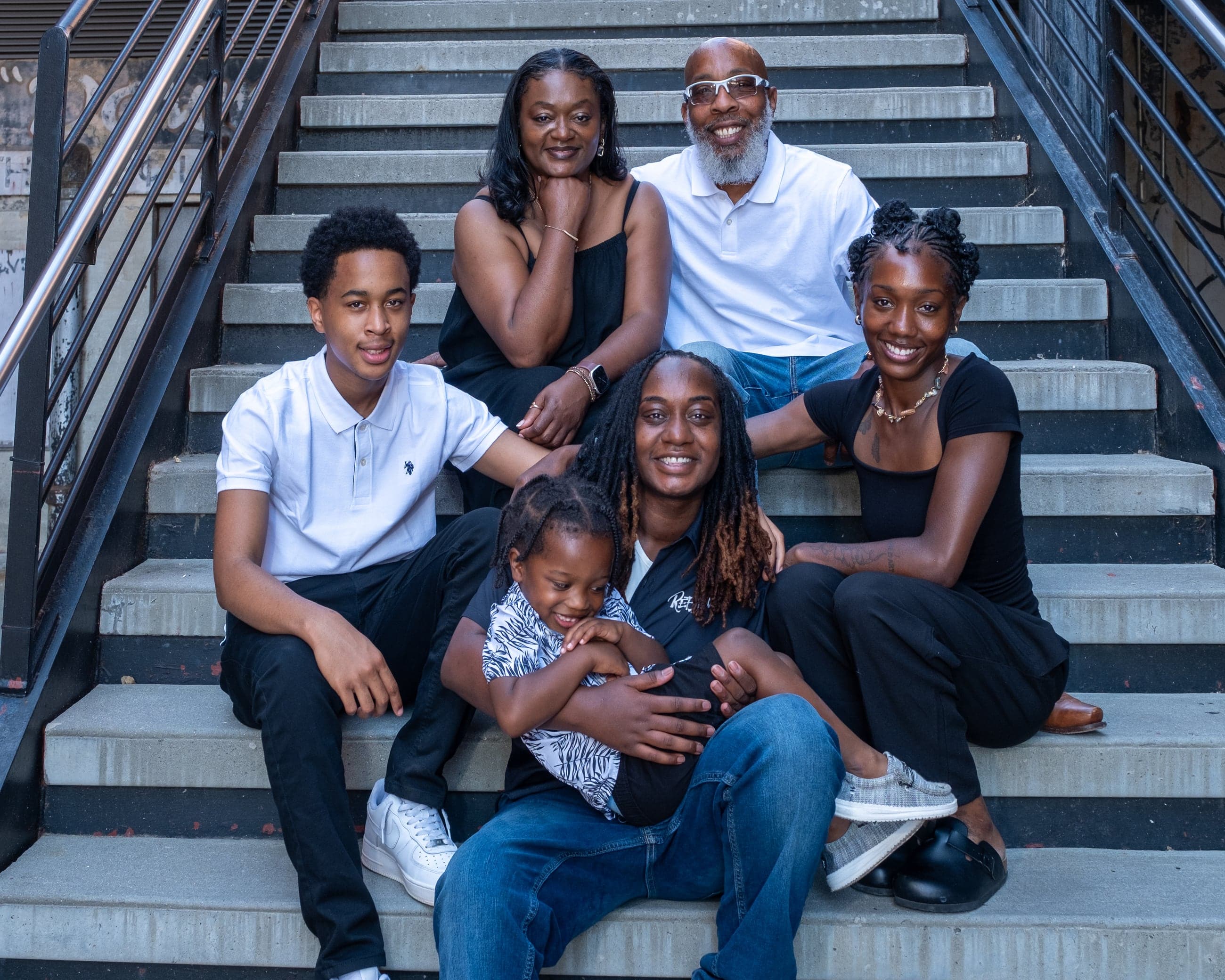 Multi-generation family portrait on urban steps