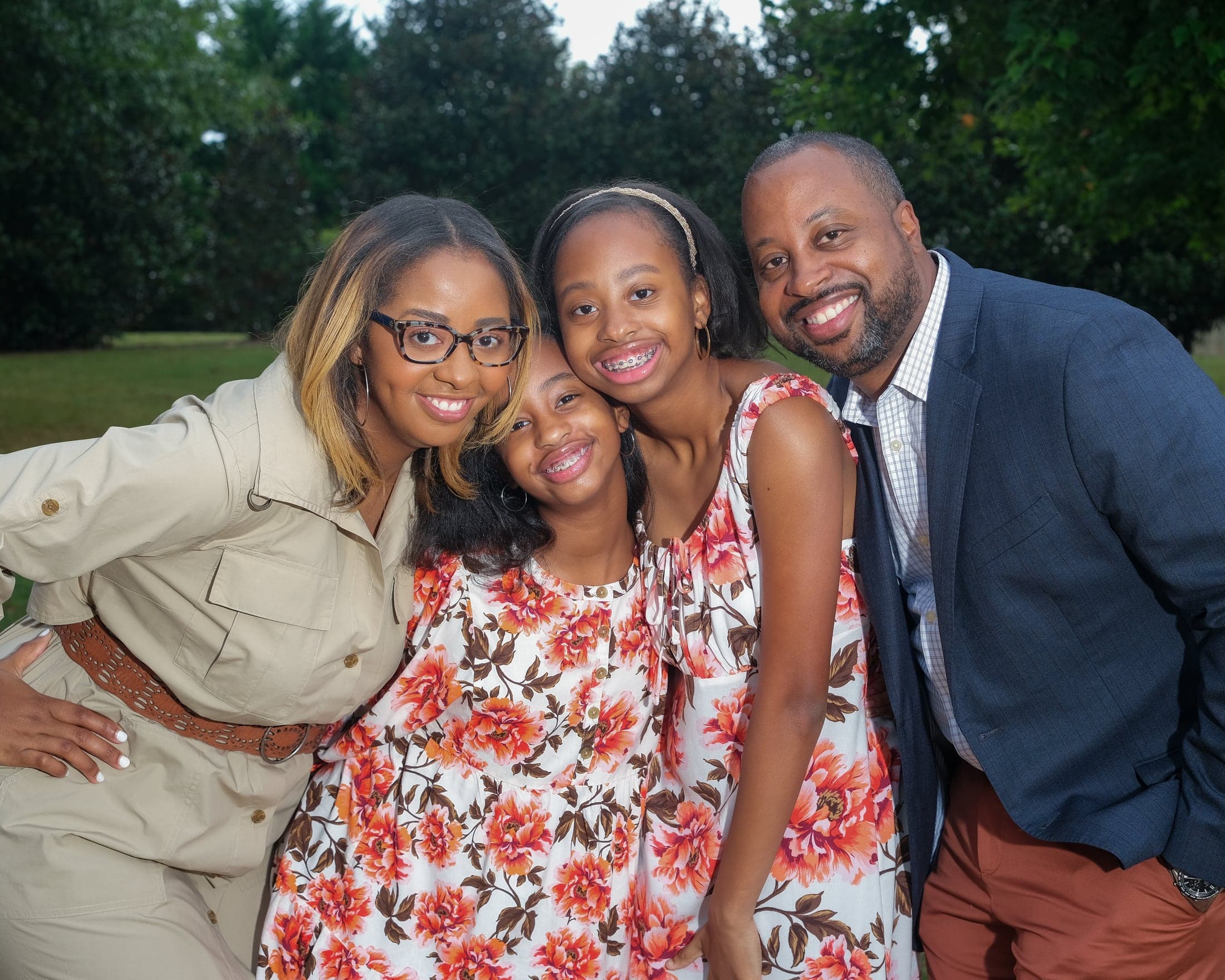 Family of four in a garden setting