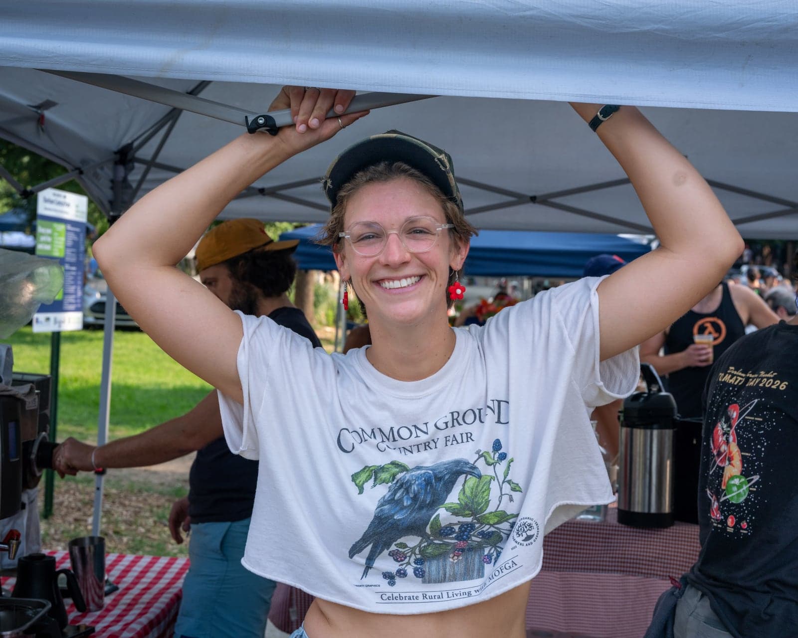 Coffee vendor laughing at her stand