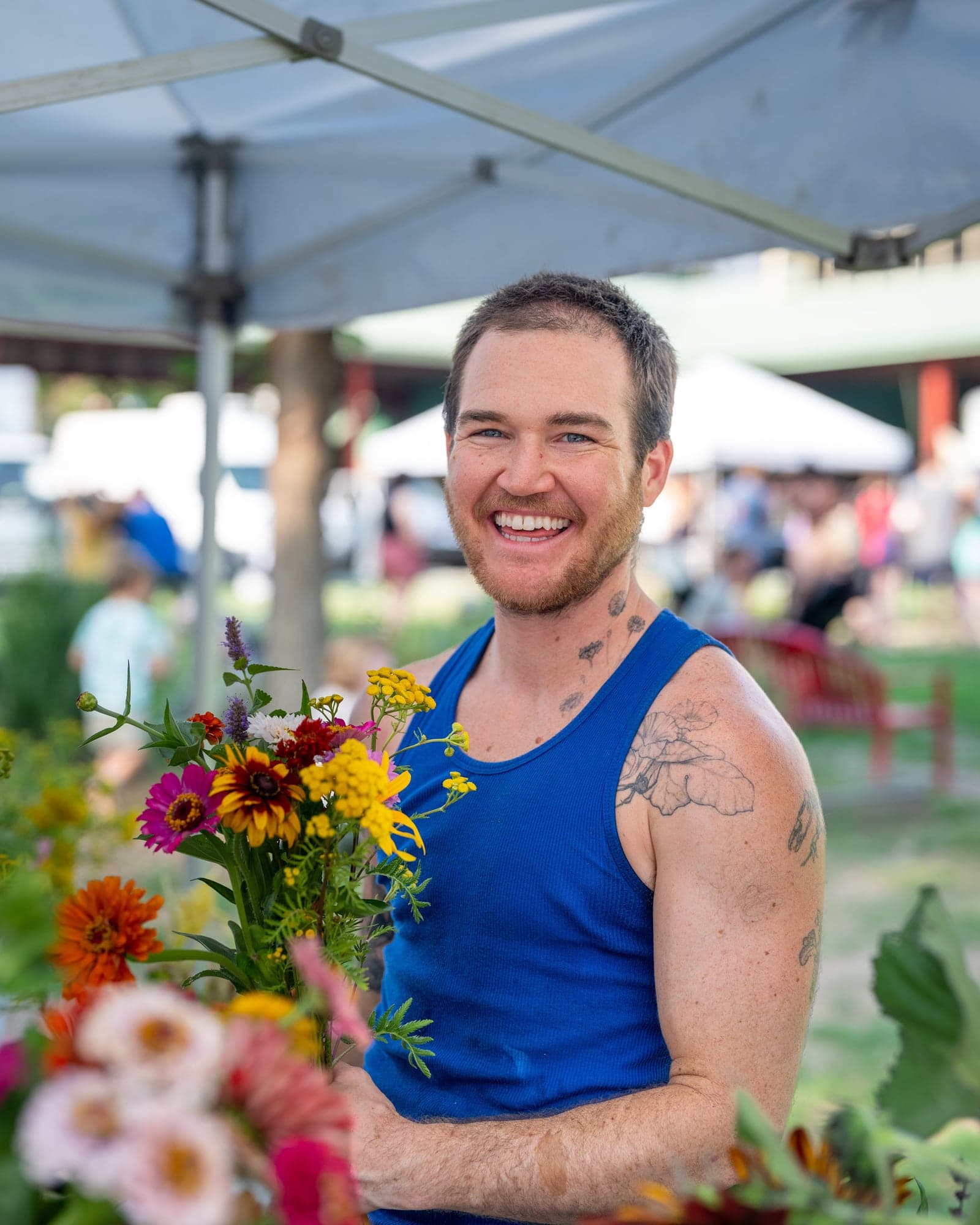 Vendor holding a fresh flower bouquet