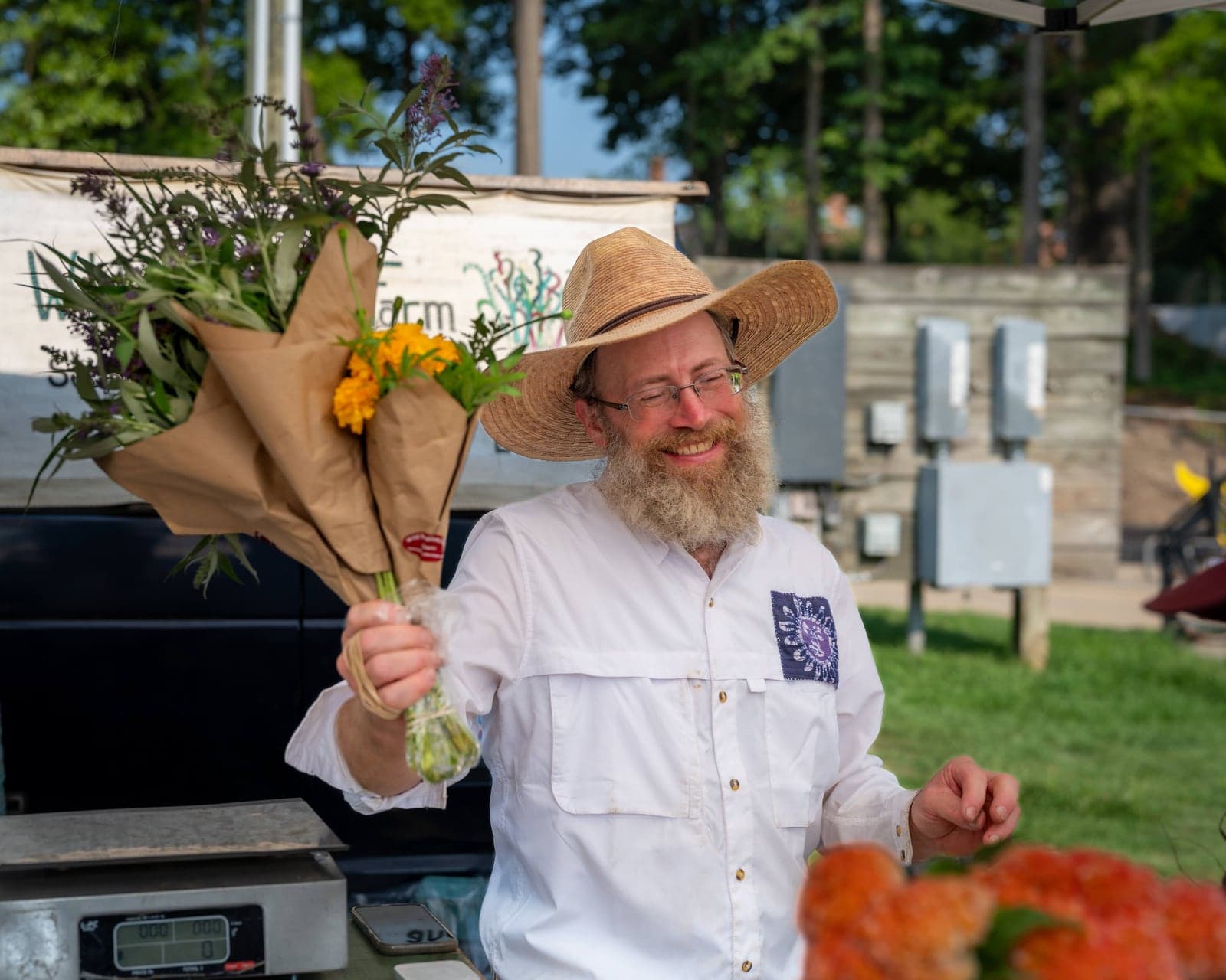 Flower vendor wrapping bouquets
