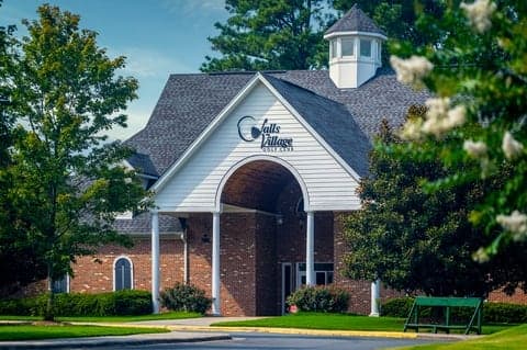 Brick clubhouse exterior with covered entrance